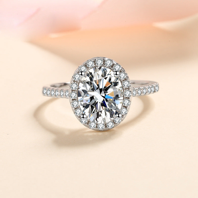 Petite Oval Halo Micropavé Moissanite Ring